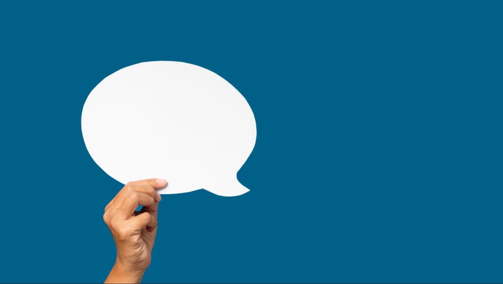 白いふきだしを持つ手